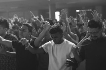 hands raised in praise during a worship service 