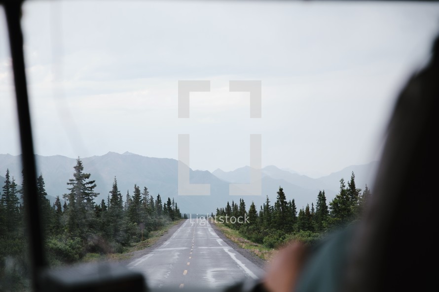 driving down a rural mountain road 