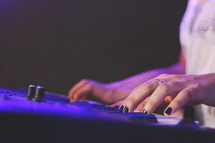 a woman playing a digital keyboard 