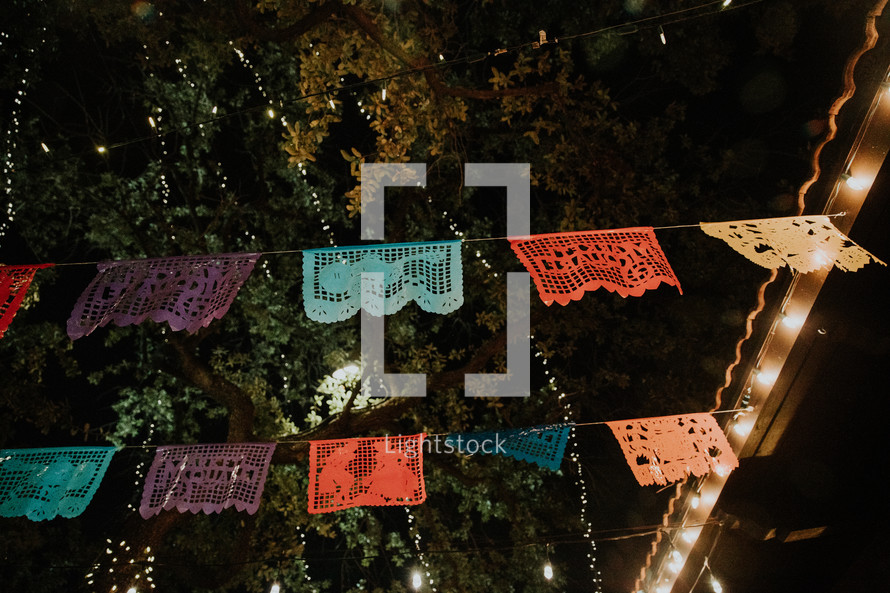 colorful lace banner outdoors at night 