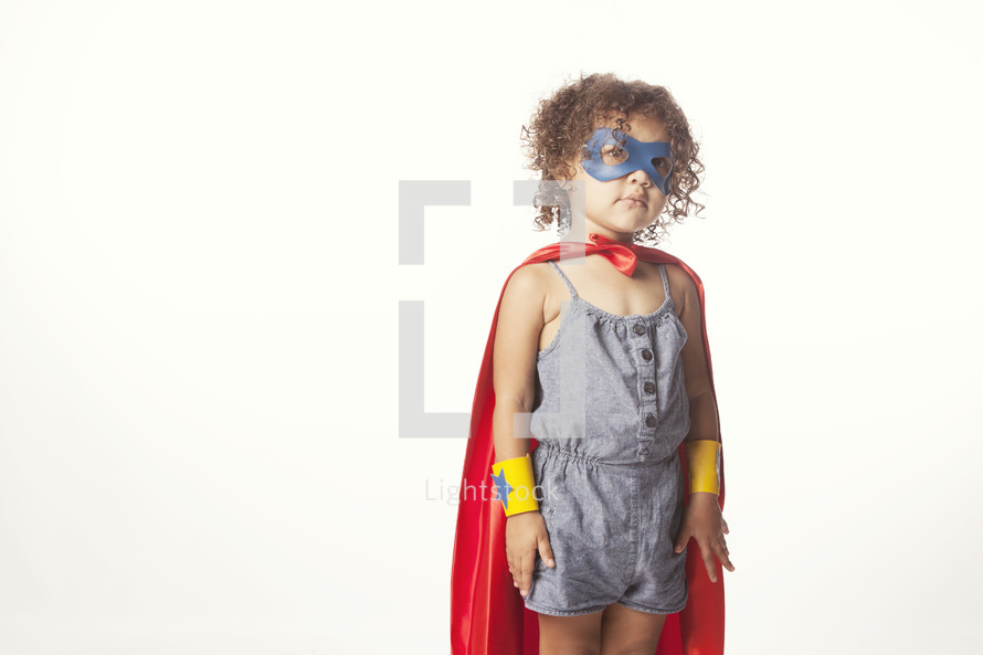 Child dressed up like a superhero.