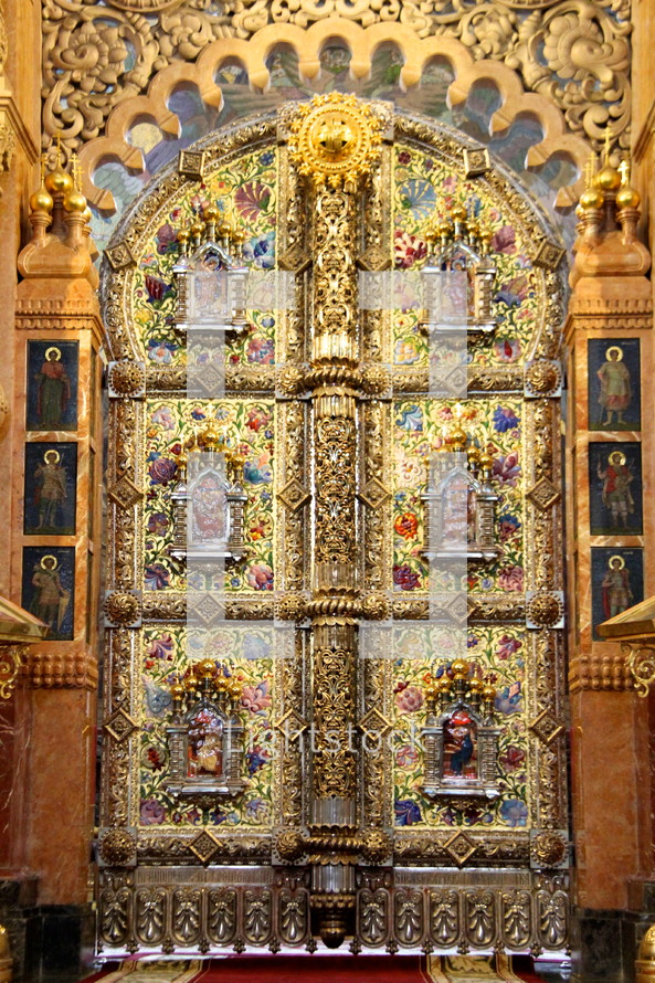 Detailed artwork on golden doors or 'beautiful gates'  leading through the 'templon' to the altar in a Russian Orthodox Church 