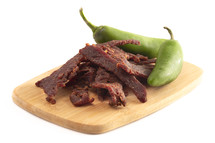 beef jerky and Fresh Jalapeno Isolated on a White Background