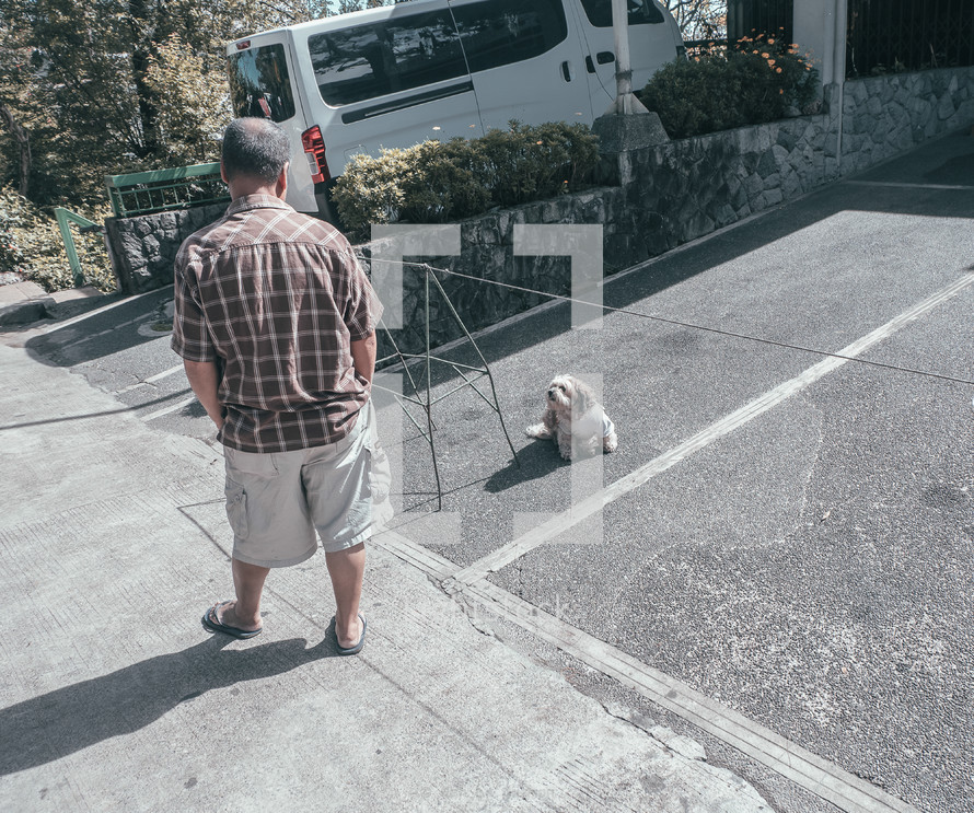 a man looking at a lost dog 