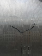 heart drawn on a foggy window 