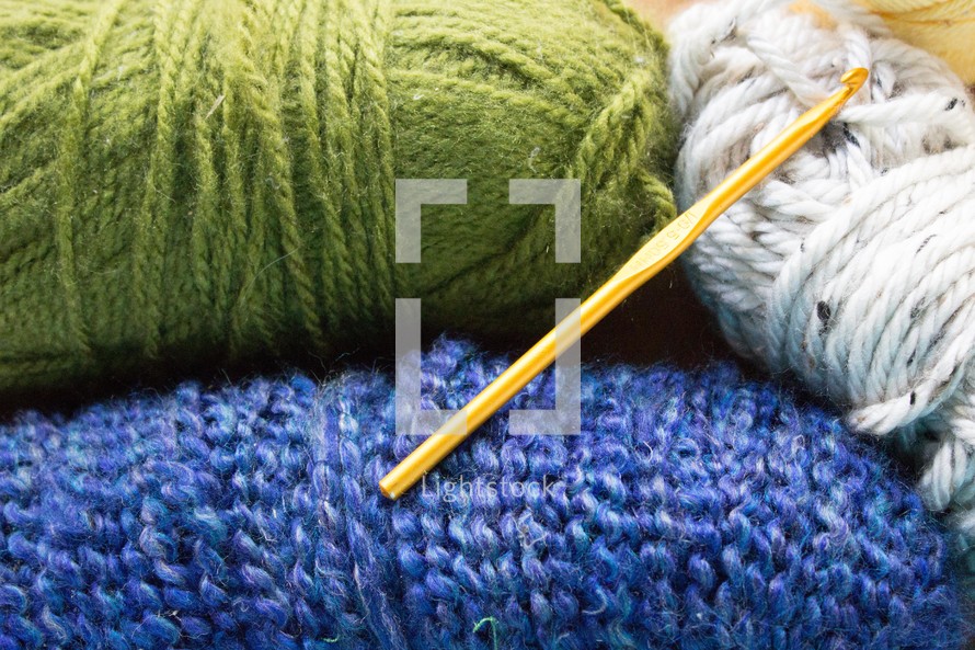 yarn and a knitting needle 