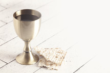 Holy Communion or the Lords Supper on a White Wooden Table