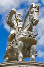 Metal statue of Kublai Khan on a horse 