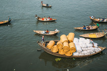 Boats with fishermen in Dhaka river in Bangladesh