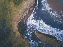 aerial view over an icy lake 