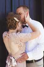 a bride and groom kissing 