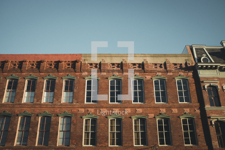 windows on a brick warehouse building 