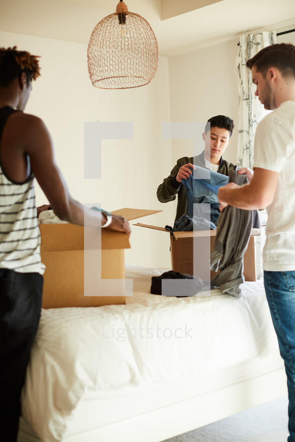 teens packing moving boxes 