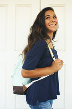 teen girl with a book bag 