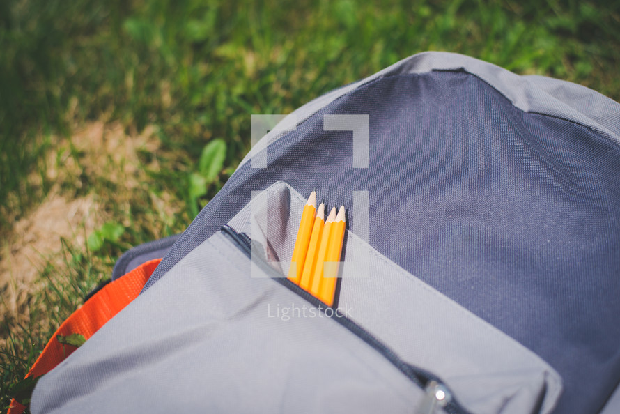 pencils in a book bag 