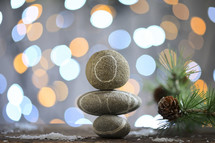 Stack of Pebble Stones and Holiday Background Glitter
