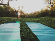 woman doing yoga at a park 