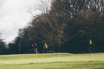 golfers on a golf course 