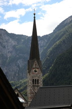 church steeple and mountains 