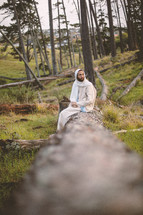 Jesus alone in a forest 