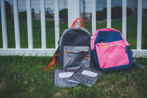 book bags in the grass