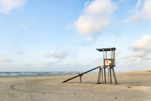 lifeguard stand on an empty beach 