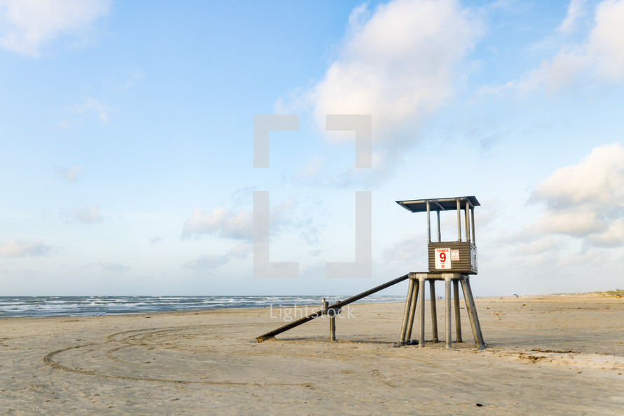 lifeguard stand on an empty beach 