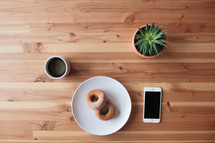 donuts and coffee on a table 