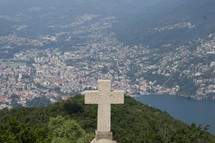 mountaintop view of an Italian town and cross