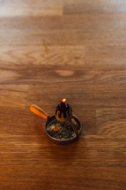 incense burner on a wood table 