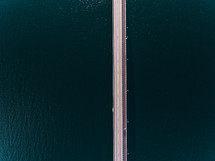 aerial view over a bridge over water 