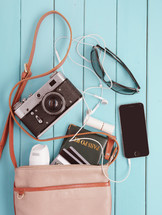 camera, purse, sunglasses, shades, passport, travel, iPhone, cellphone, earbuds, credit cards, bag
