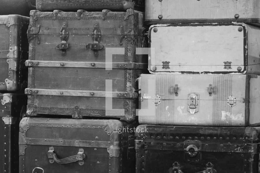 vintage luggage and trunks at an old train depot 