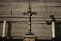 crucifix and candles in a church 
