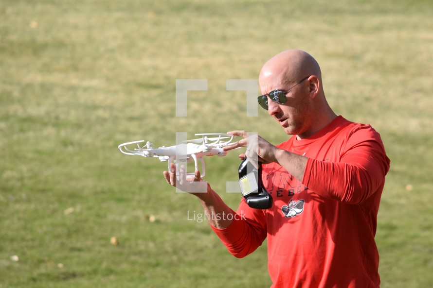 a man holding a drone 