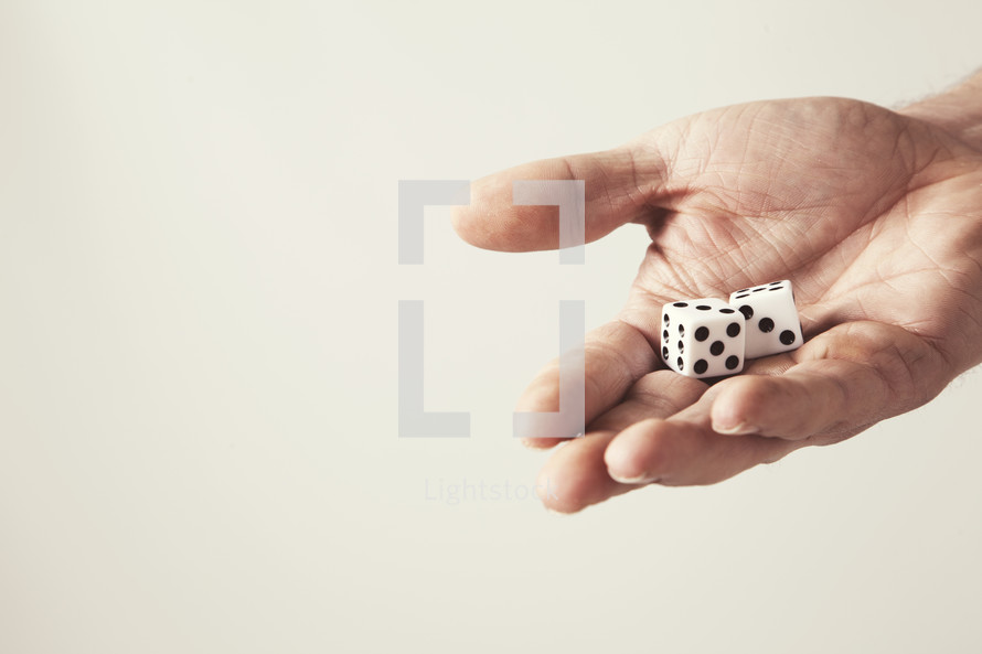 Hand holding dice.