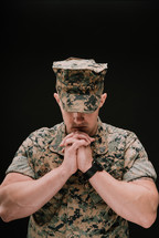 marine with praying hands 