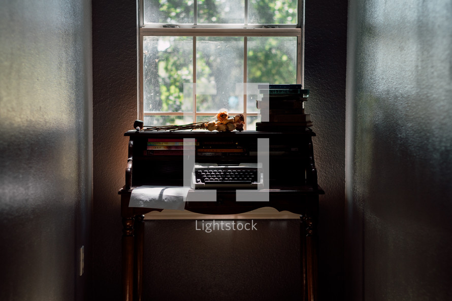 a secretary desk in a window 