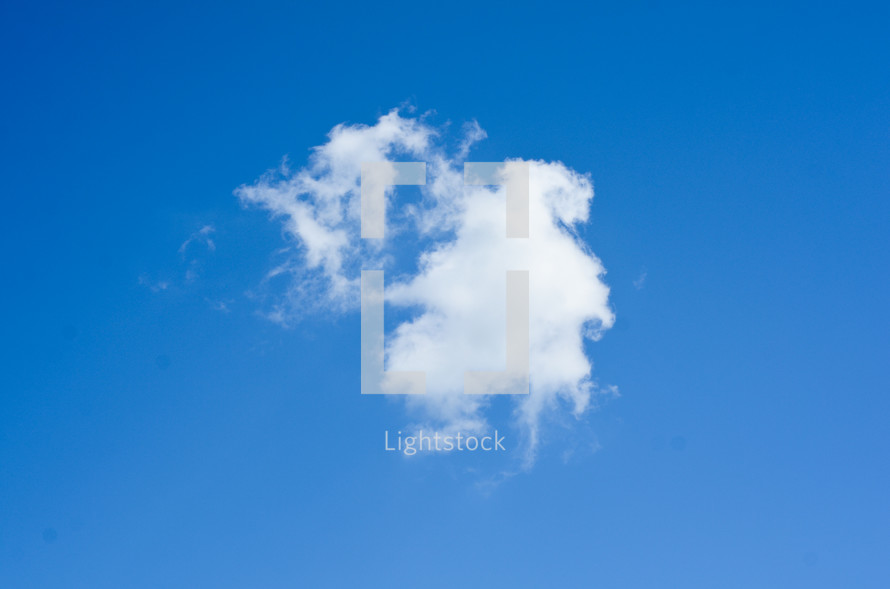 a white cloud in a blue sky