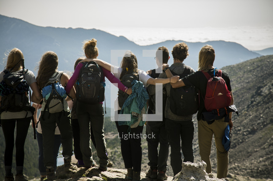 a group hiking on a mountain 