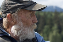 an elderly man with a white beard 