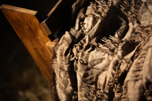 closeup manger against a black background 