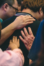 lying on of hands during a worship service 