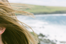Woman's hair near the ocean.