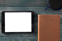 tablet, Bible, and coffee cup 