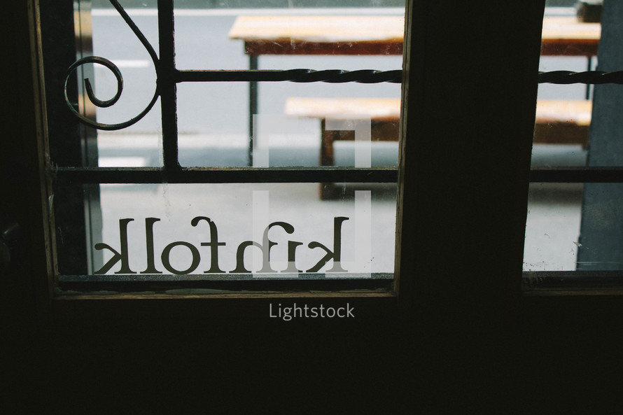 kinfolk sign in a window 