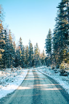 snow along a rural roadside 