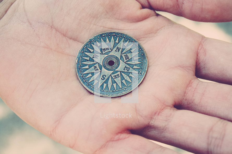 Compass on a hand.