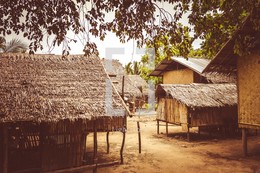 thatched and straw roofed huts in a village 