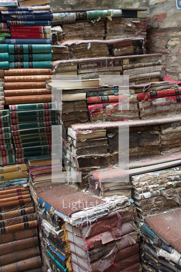 worn books in a stack 